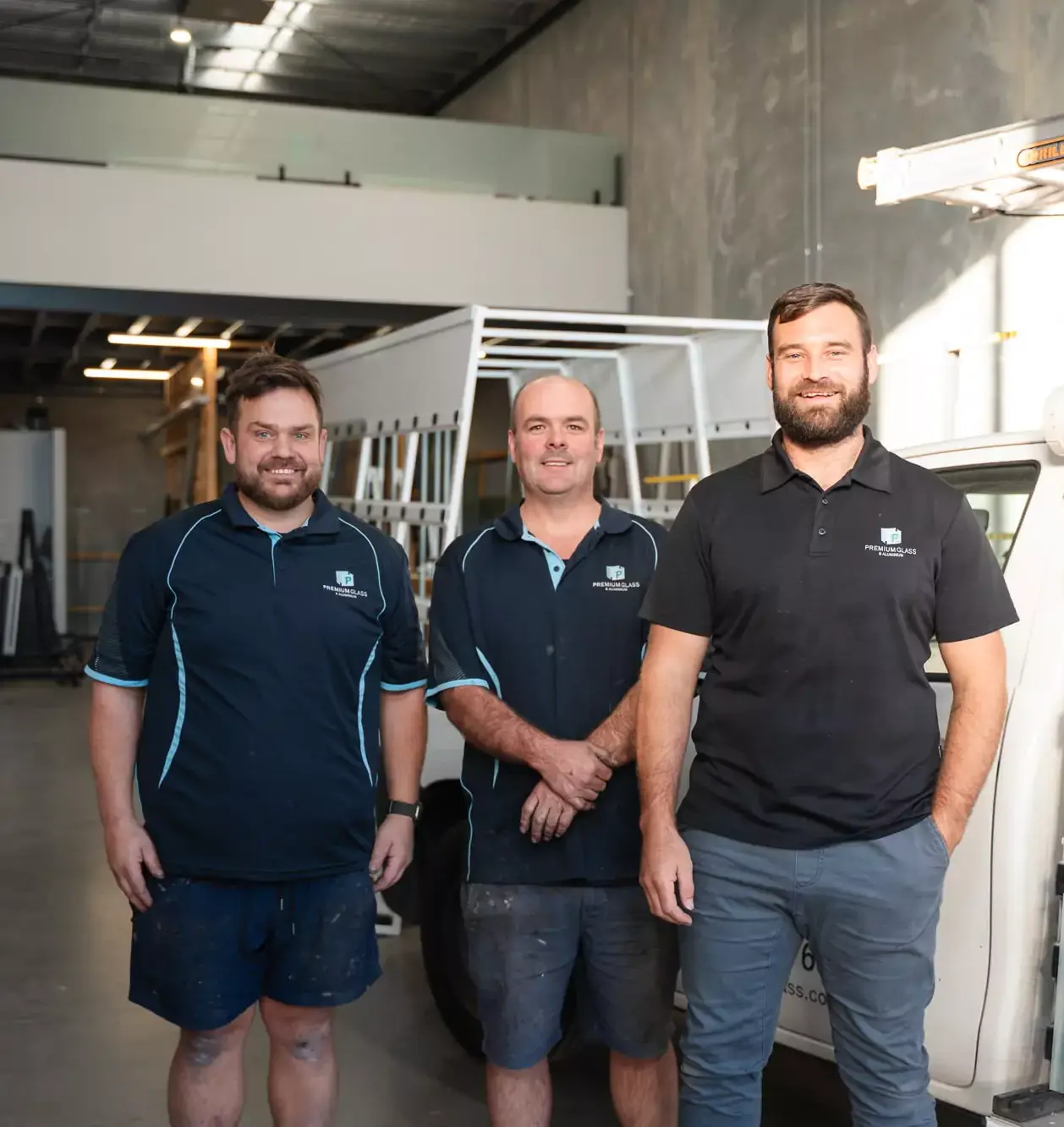 Craig, founder of Premium Glass & Aluminium, standing with his professional glazing team