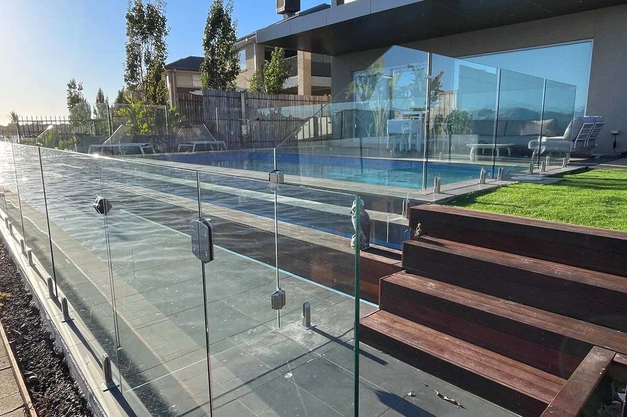 Cleanly installed glass pool fencing symbolizing professional service and finish in Altona North