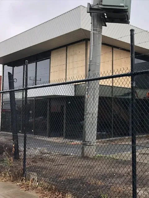 Modern commercial building with large glass walls, showcasing expert glazing and structural compliance