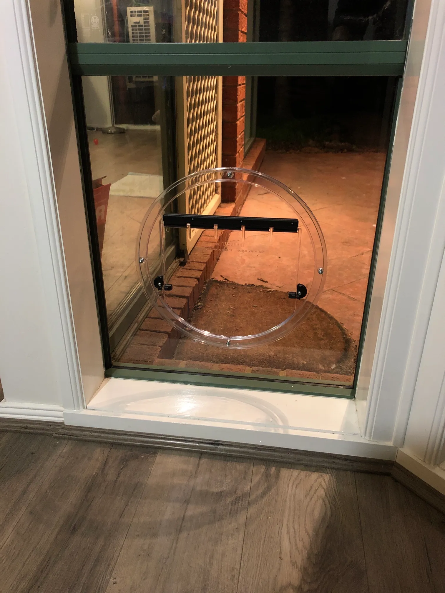 Pet door built into a glass door, allowing pets to move safely and independently
